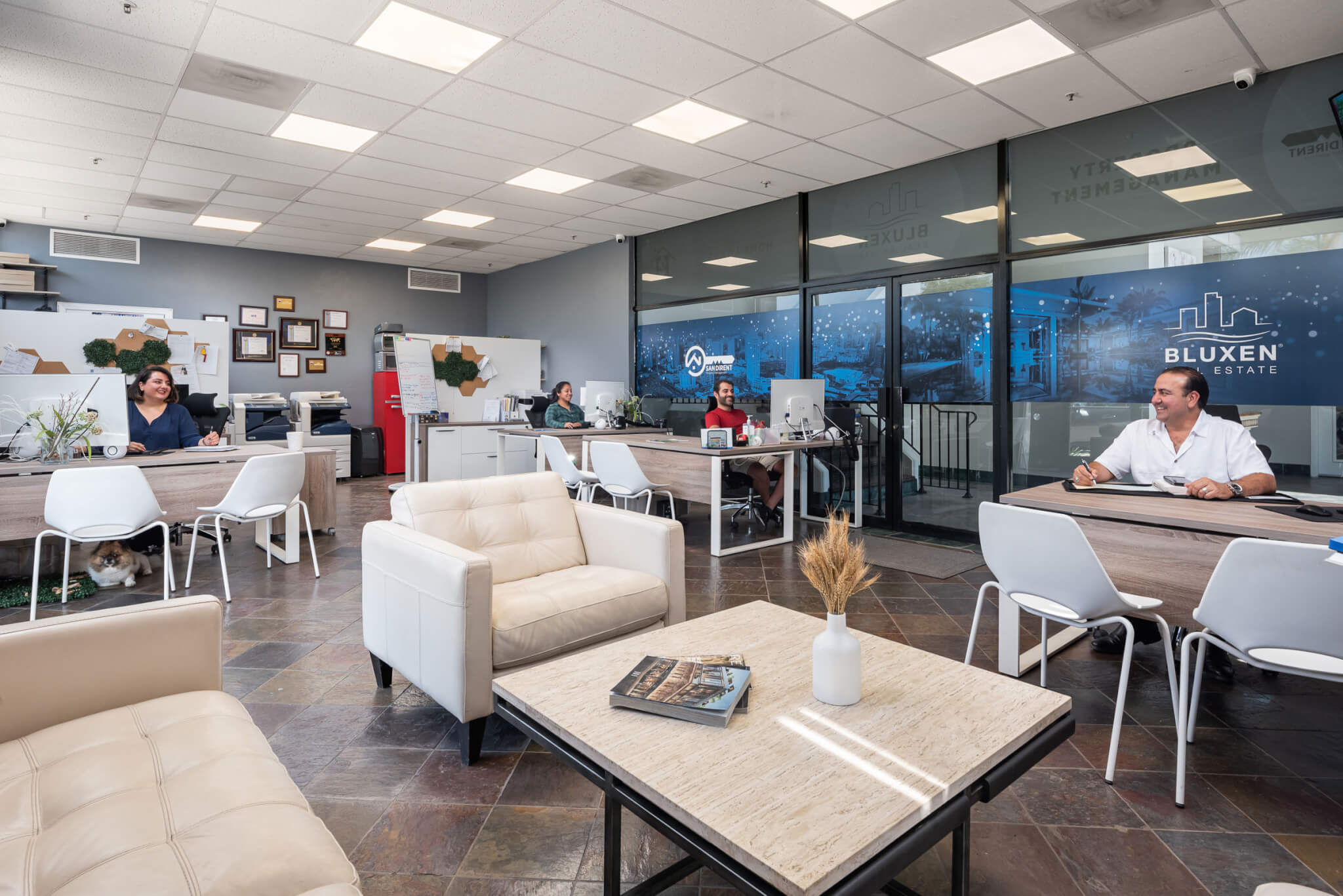 The Sandirent office, with the team at their desks behind the lounge seating